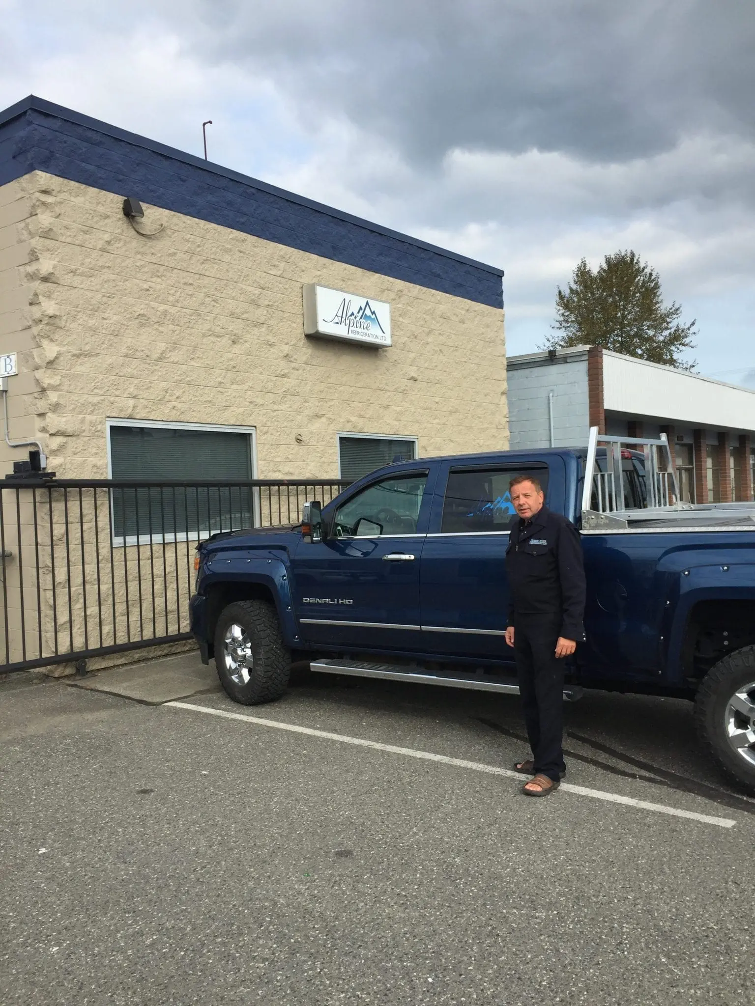 GMC Denali Service Truck at Headquarters Alpine Refrigeration owner with GMC Denali HD truck at Chilliwack headquarters